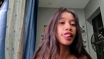 A Small Asian Woman With Petite Features